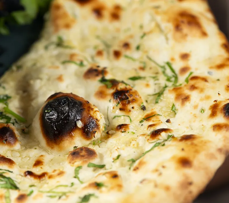 Freshly baked bread, with coriander and the marks of the oven